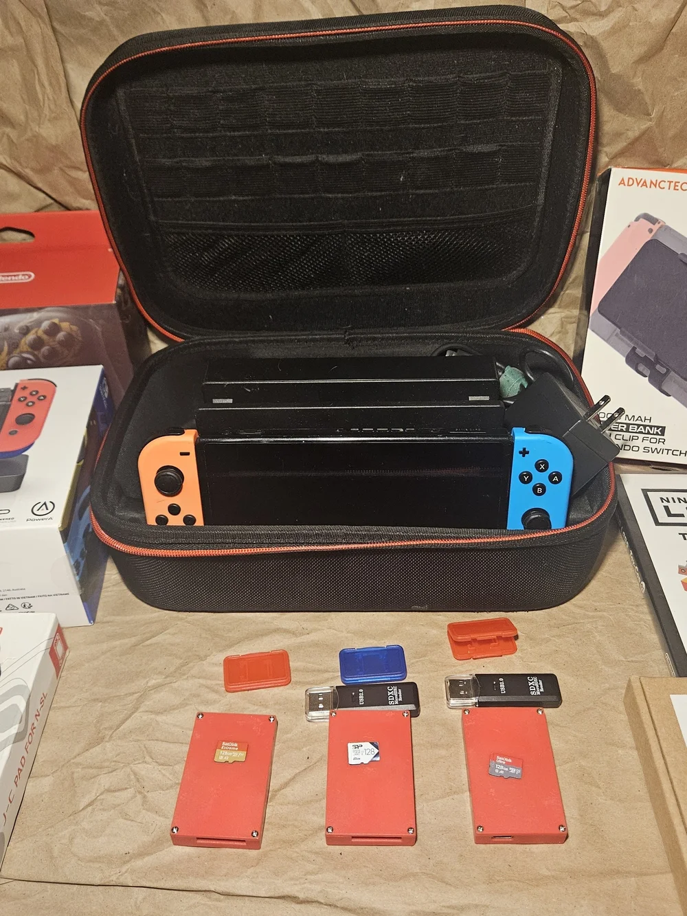 Nintendo Switch Console with Orange Left & Blue Right Joy-Con and Travel Case